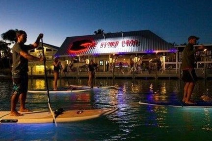 a person standing next to a body of water