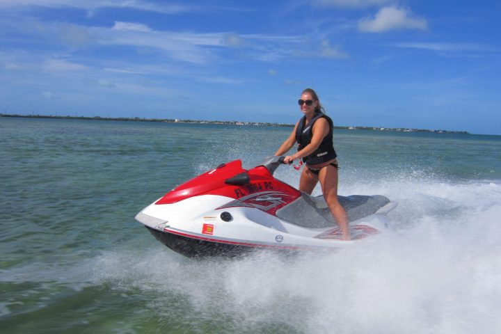 a man riding a wave on top of a body of water